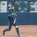 Michigan senior Ashley Lane hits the ball during the forth  inning for their game against Iowa at Alumni field Saturday, April 20.
Courtney Sacco I AnnArbor.com